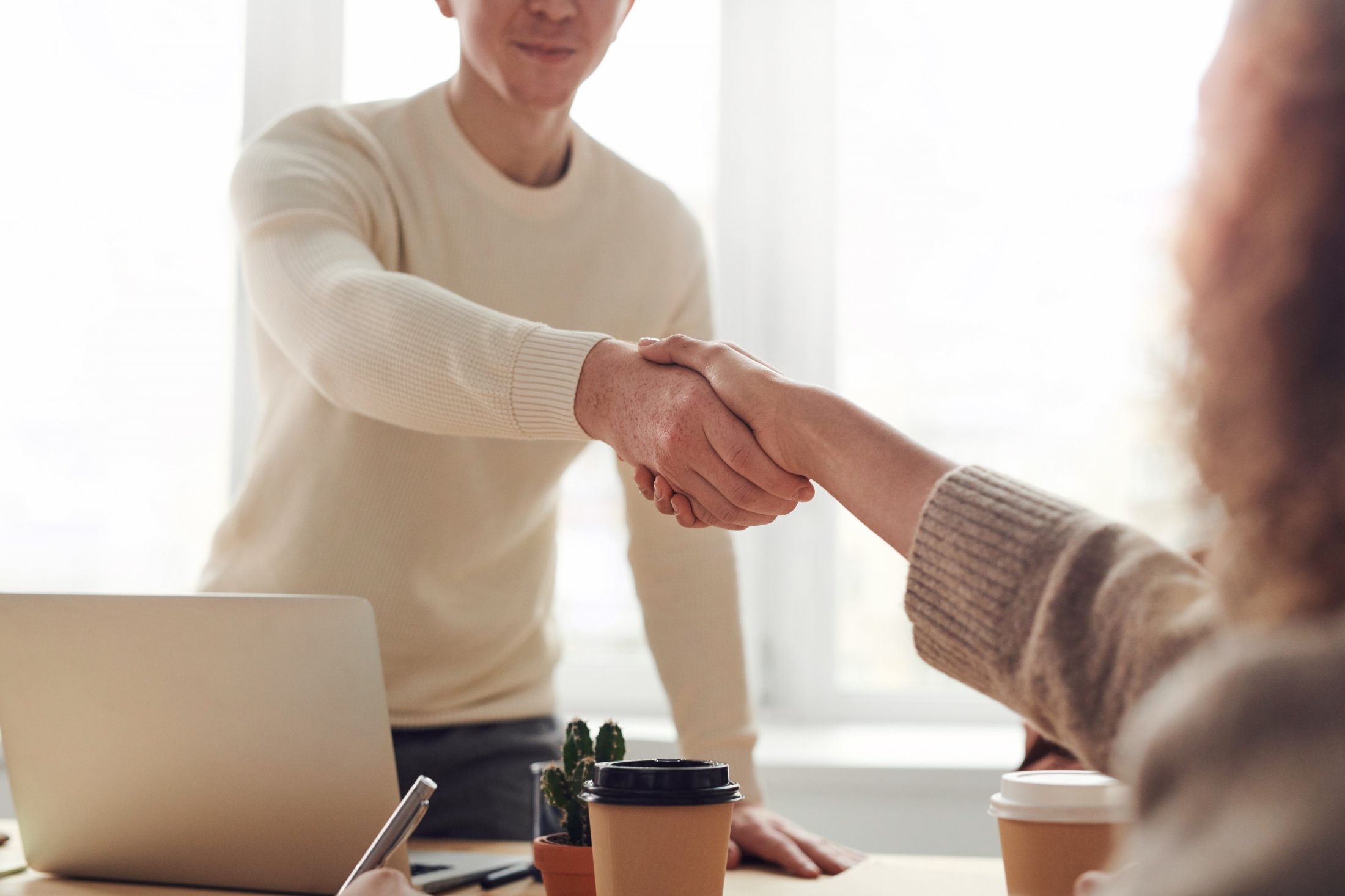 Candidate shaking hands with interview at a job interview